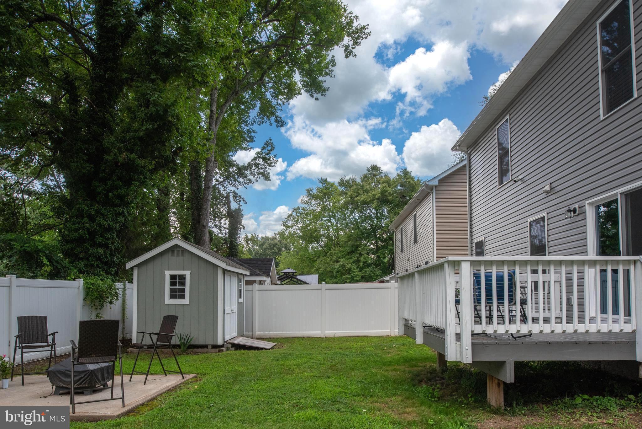 133 7th Street Colonial Beach, VA 22443 - Photo 10 of 72 a view of backyard with deck