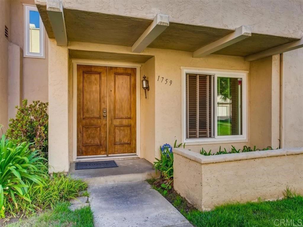 1759 Edgefield Lane Encinitas, CA 92024 - Photo 2 of 10 a front view of a house with a yard