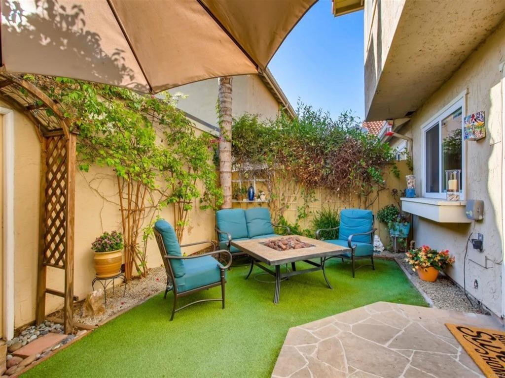 1759 Edgefield Lane Encinitas, CA 92024 - Photo 7 of 10 a backyard of a house with table and chairs