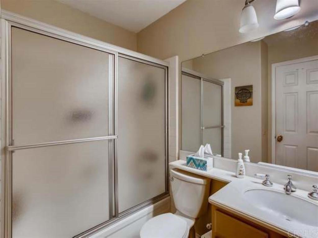 1759 Edgefield Lane Encinitas, CA 92024 - Photo 8 of 10 a bathroom with a sink toilet and shower