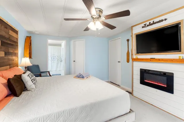 a bedroom with a bed and a fireplace