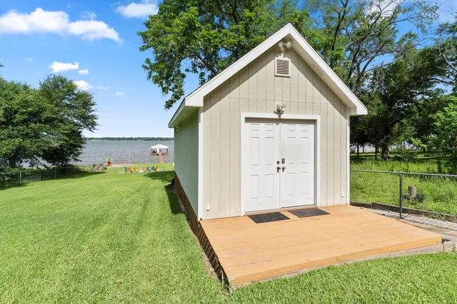 a view of a backyard with a garden and plants