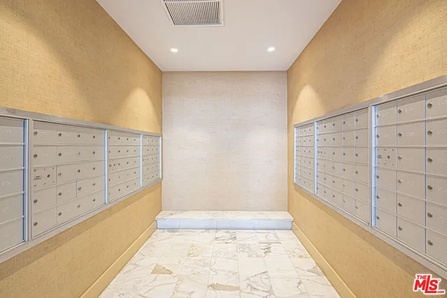 a view of walk in closet and bathroom