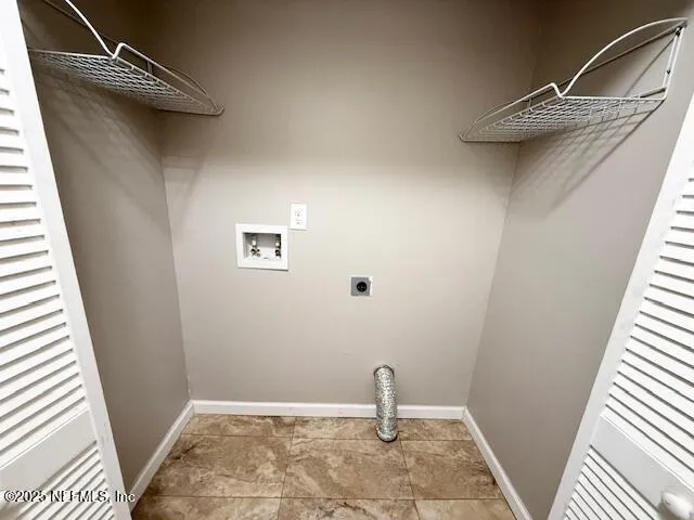 a view of a porch and a floor to ceiling window