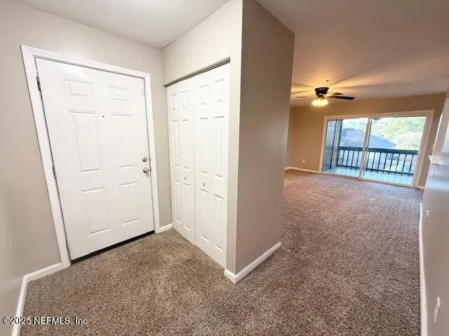 a view of empty room with windows