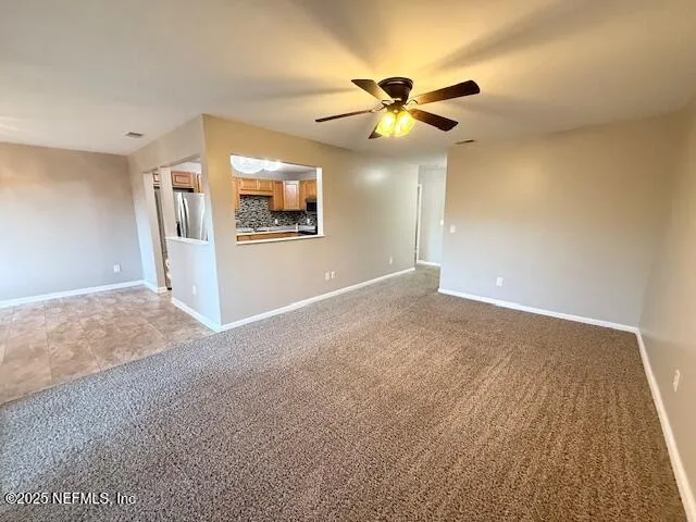 a view of a kitchen with a sink and cabinets
