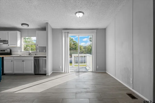 a view of a kitchen with a sink and dishwasher kitchen view