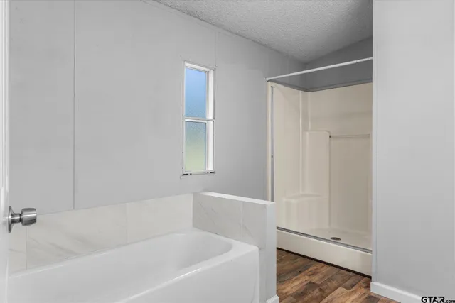 a white bath tub sitting next to a window