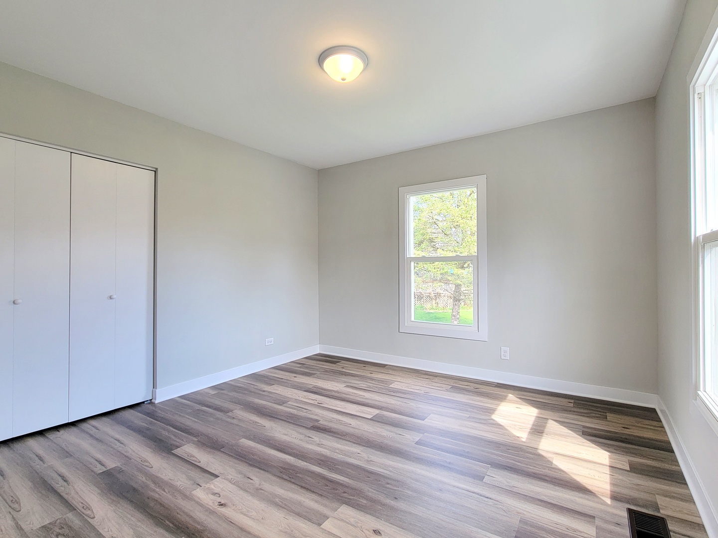 S333 Winfield Road Winfield, IL 60190 - Photo 17 of 37 an empty room with wooden floor and windows