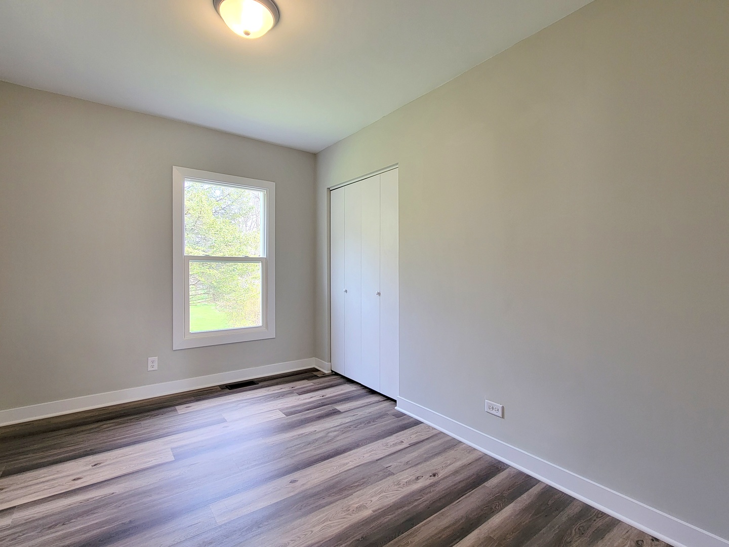 S333 Winfield Road Winfield, IL 60190 - Photo 18 of 37 an empty room with wooden floor and windows
