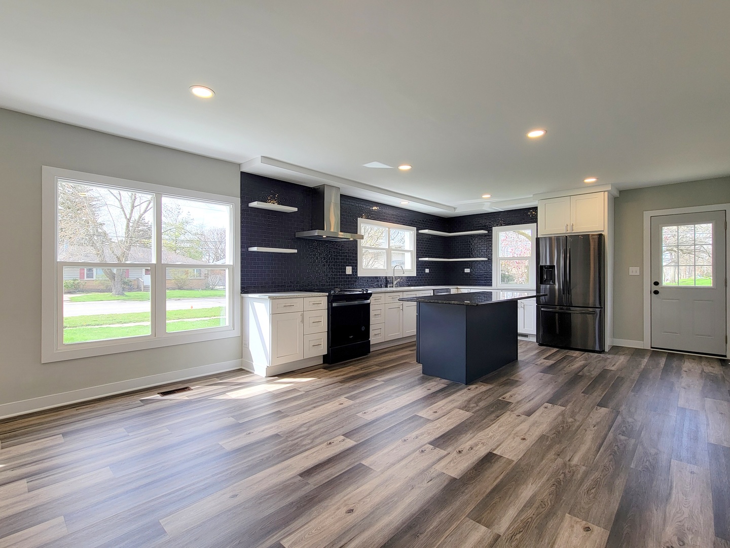 S333 Winfield Road Winfield, IL 60190 - Photo 3 of 37 an open kitchen with a refrigerator and wooden floor