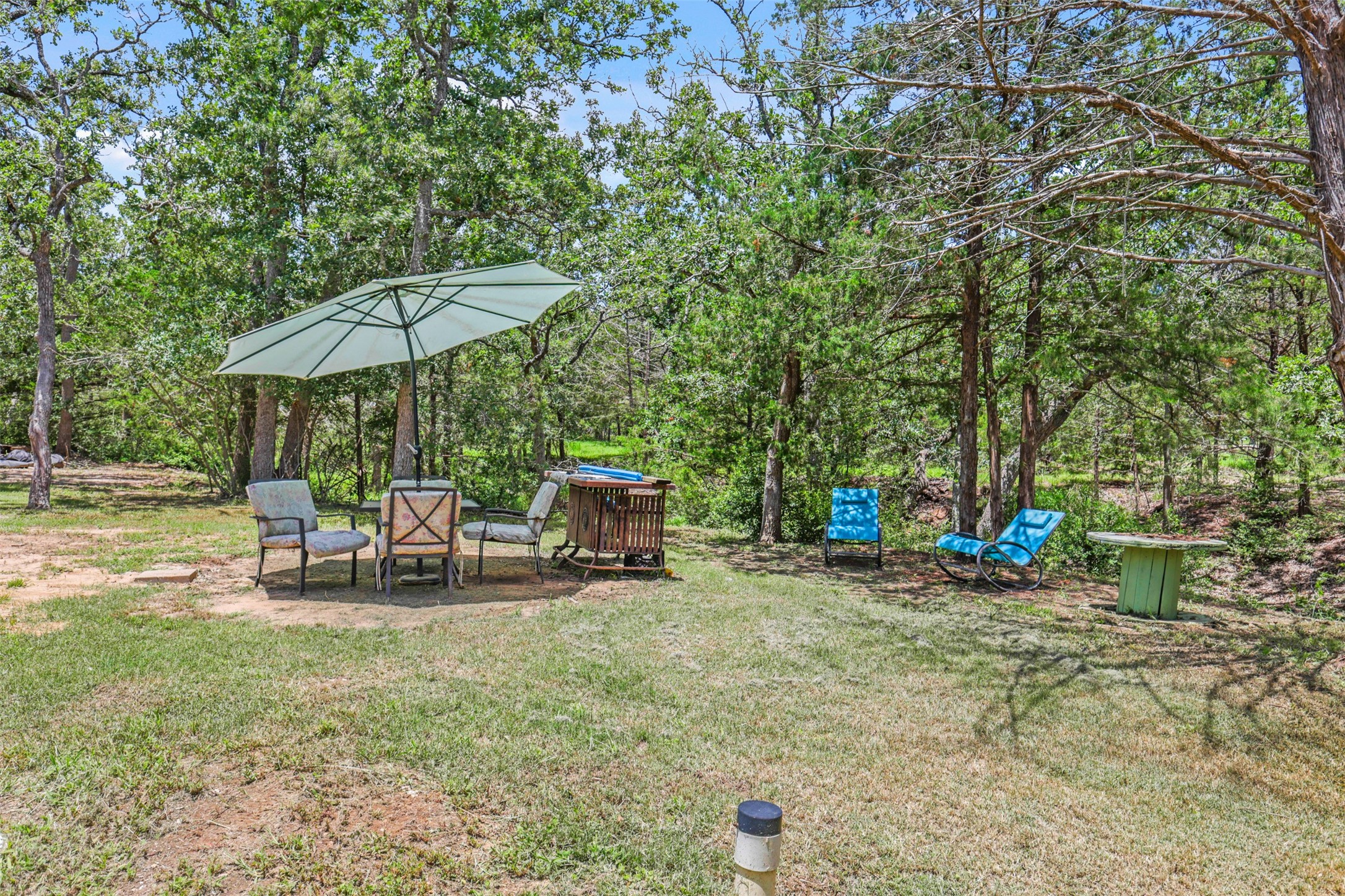 735 Boysenberry Road Somerville, TX 77879 - Photo 20 of 36 a view of a outdoor space with furniture and umbrella