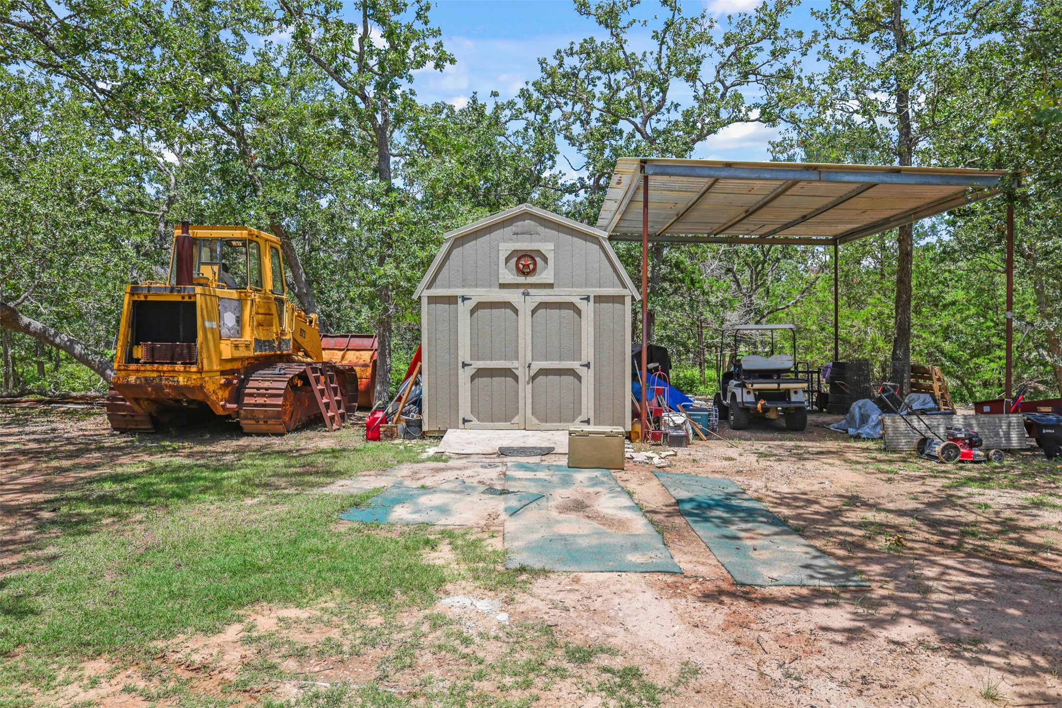 735 Boysenberry Road Somerville, TX 77879 - Photo 21 of 36 a front view of a house with a large tree and a yard