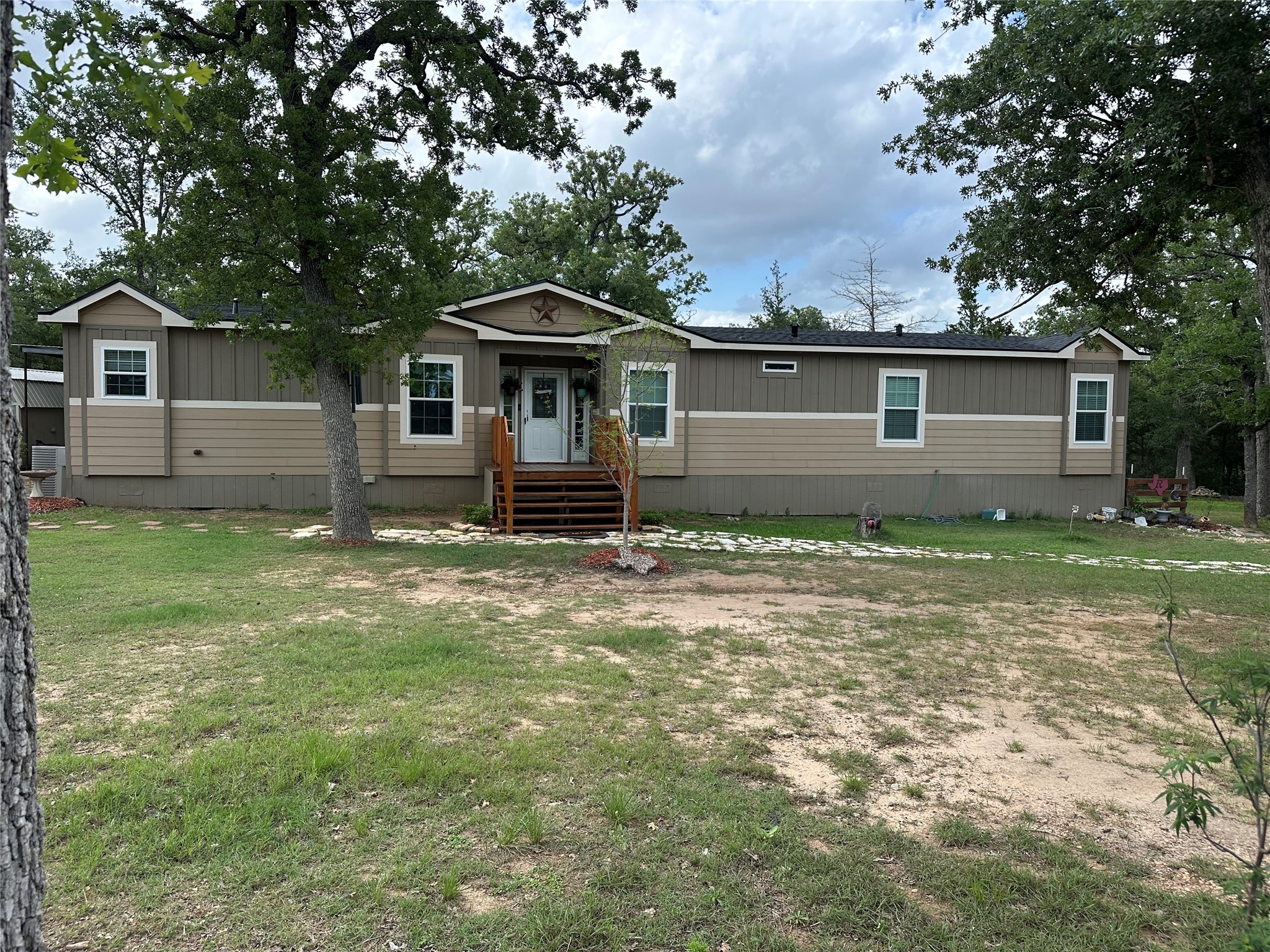 735 Boysenberry Road Somerville, TX 77879 - Photo 3 of 36 front view of a house with a yard