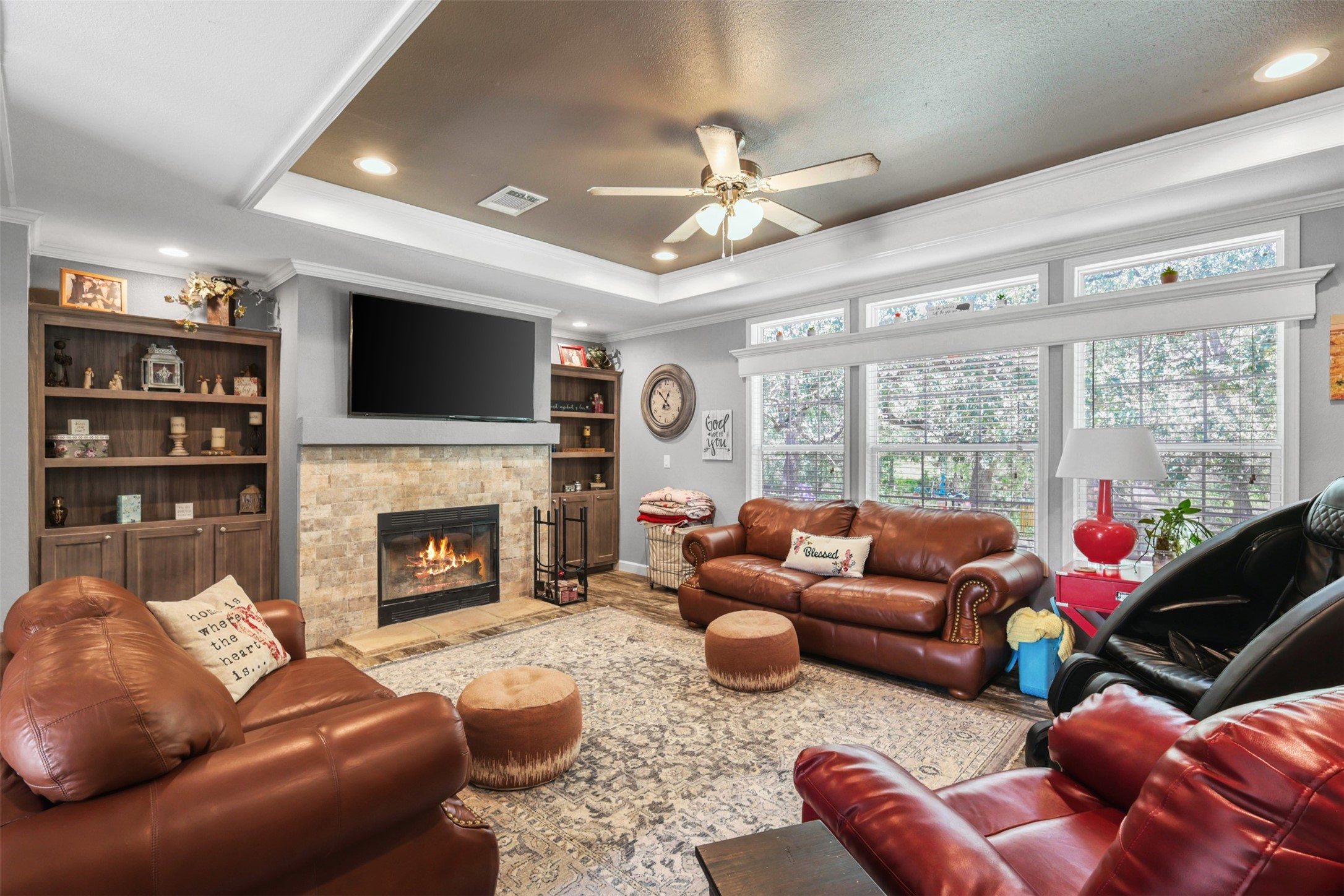 735 Boysenberry Road Somerville, TX 77879 - Photo 7 of 36 a living room with furniture a fireplace and a flat screen tv