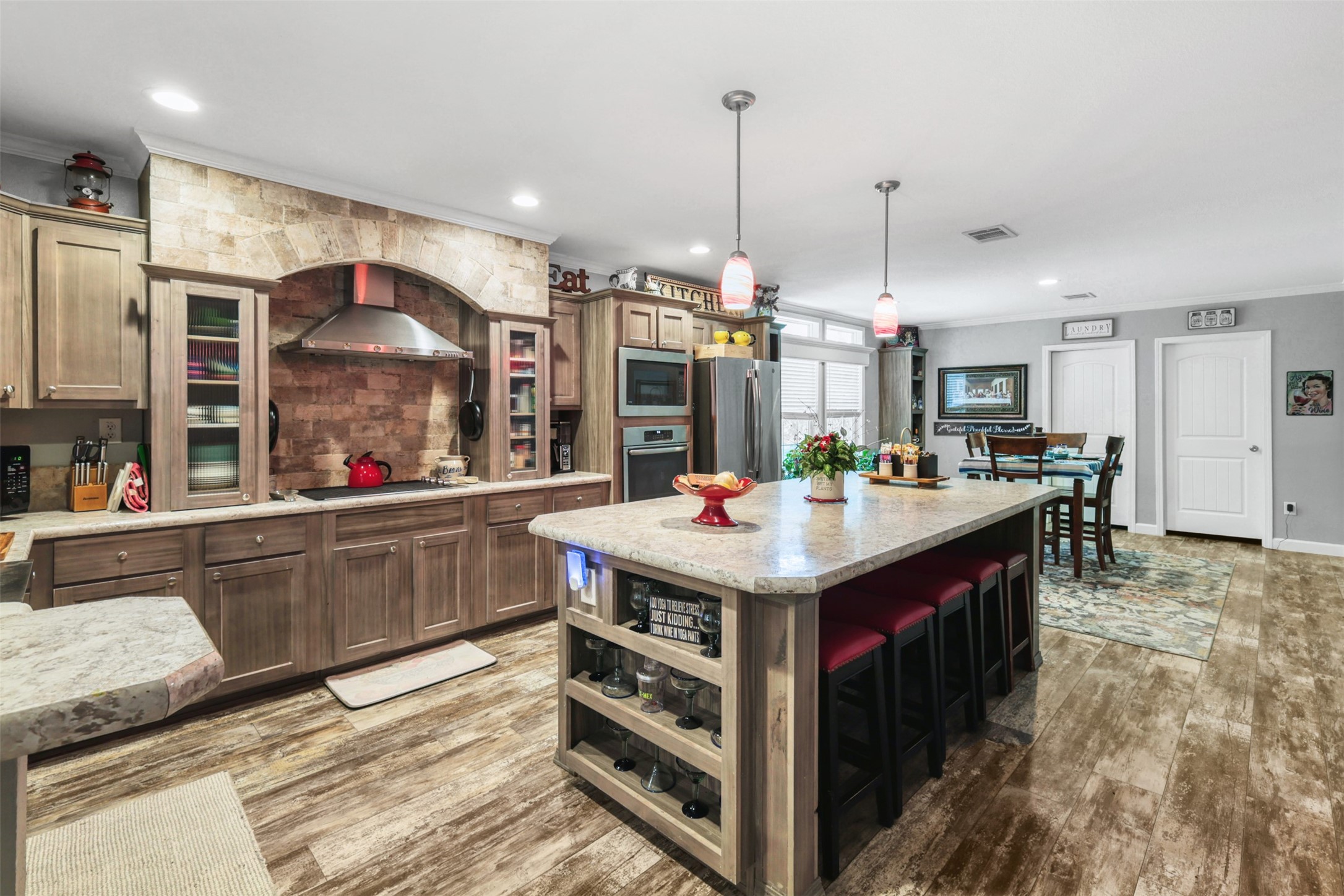 735 Boysenberry Road Somerville, TX 77879 - Photo 8 of 36 a kitchen with kitchen island granite countertop a sink and a stove