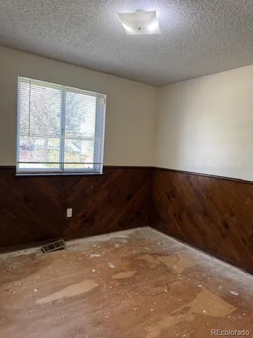 a black and white bed in a room