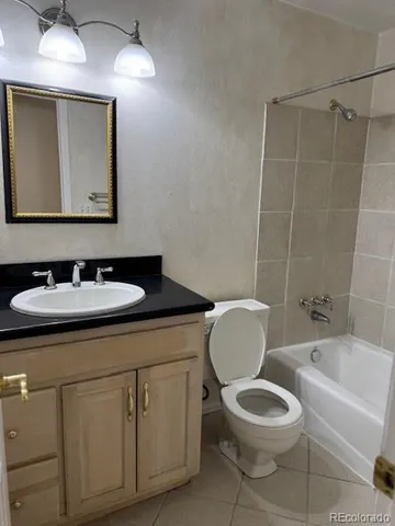 a bathroom with a sink toilet a mirror and shower