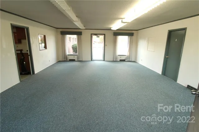 a view of empty room with windows