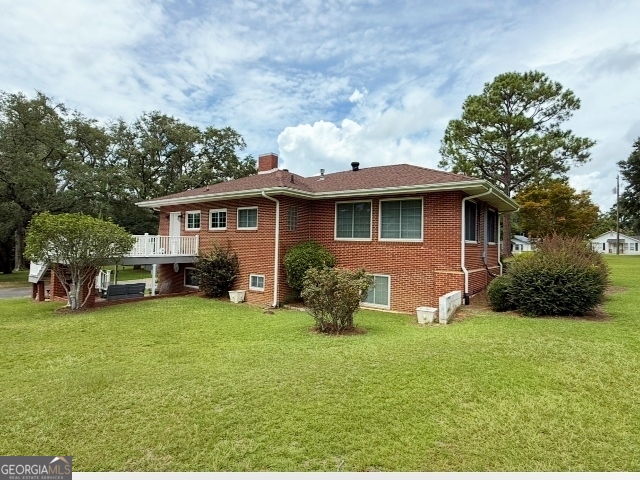 7586 Eastman Road Soperton, GA 30457 - Photo 2 of 29 a view of a house with backyard