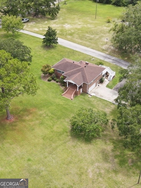 7586 Eastman Road Soperton, GA 30457 - Photo 23 of 29 a view of a lake with a yard