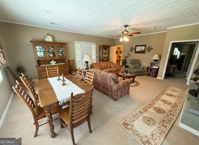 7586 Eastman Road Soperton, GA 30457 - Photo 6 of 29 a living room with furniture and wooden floor