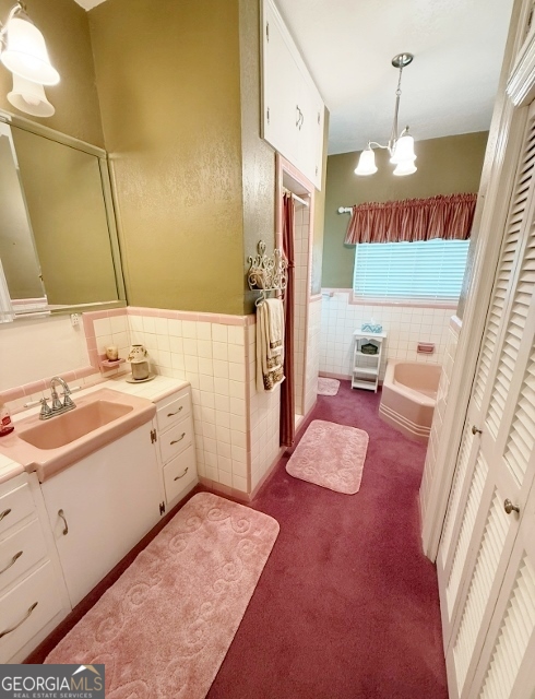 7586 Eastman Road Soperton, GA 30457 - Photo 10 of 29 a bathroom with a granite countertop sink a mirror and shower
