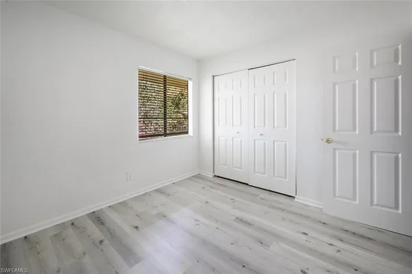 a white toilet sitting next to a bath tub