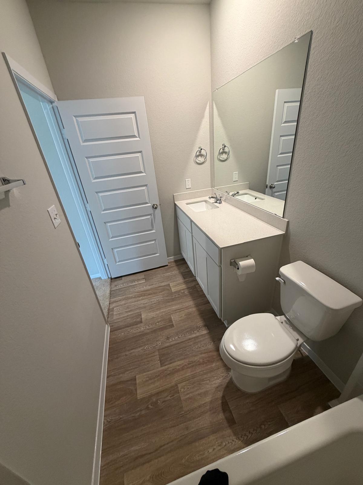 2612 Towy Road Manor, TX 78653 - Photo 16 of 35 A well-appointed bathroom with durable flooring and modern vanity offers practical comfort.