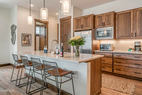 a kitchen with cabinets and window