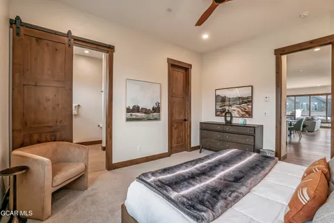 a bedroom with a bed and a couch