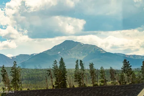 a view of a city with mountains in the background