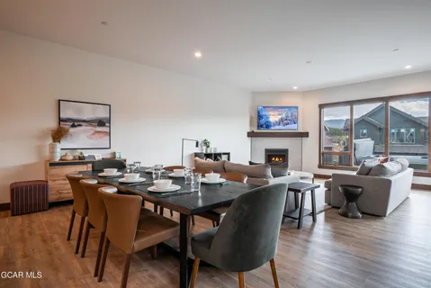 a view of a dining room with furniture window and wooden floor