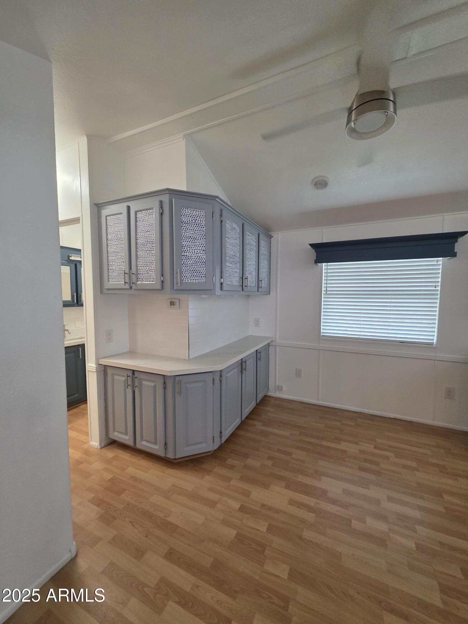 7750 East Broadway Road, Unit LOT 619 Mesa, AZ 85208 - Photo 11 of 33 a view of a kitchen with wooden cabinet