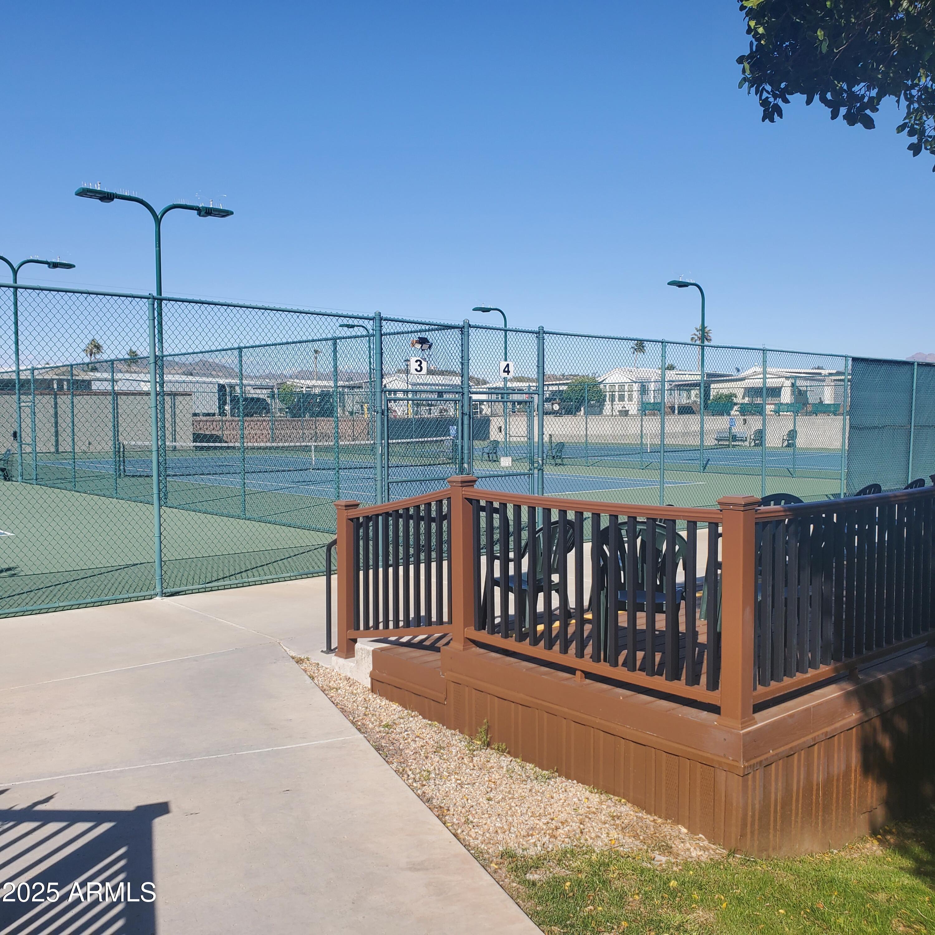 7750 East Broadway Road, Unit LOT 619 Mesa, AZ 85208 - Photo 18 of 33 a view of a balcony with wooden floor