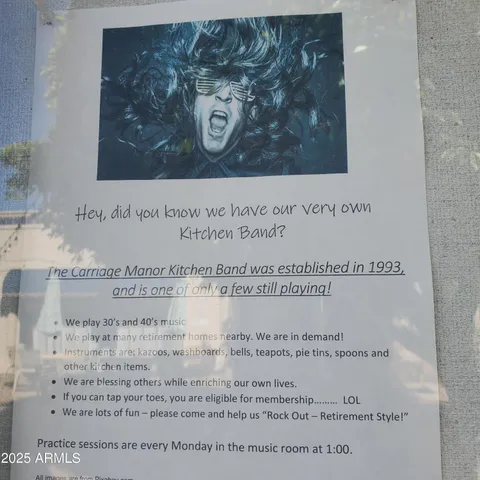 a living room with furniture and a book shelf