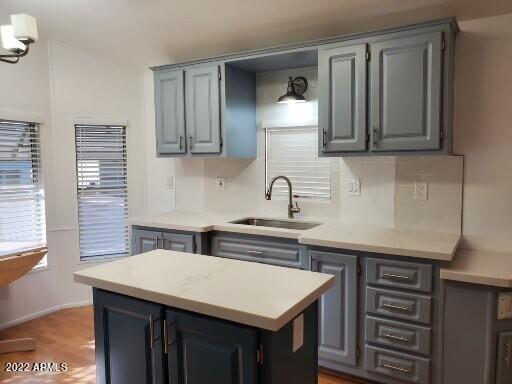 7750 East Broadway Road, Unit LOT 619 Mesa, AZ 85208 - Photo 3 of 33 a kitchen with a sink cabinets and a window