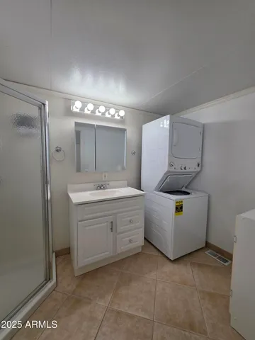 a bathroom with a sink a vanity and mirror