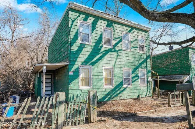 a front view of a house with a porch