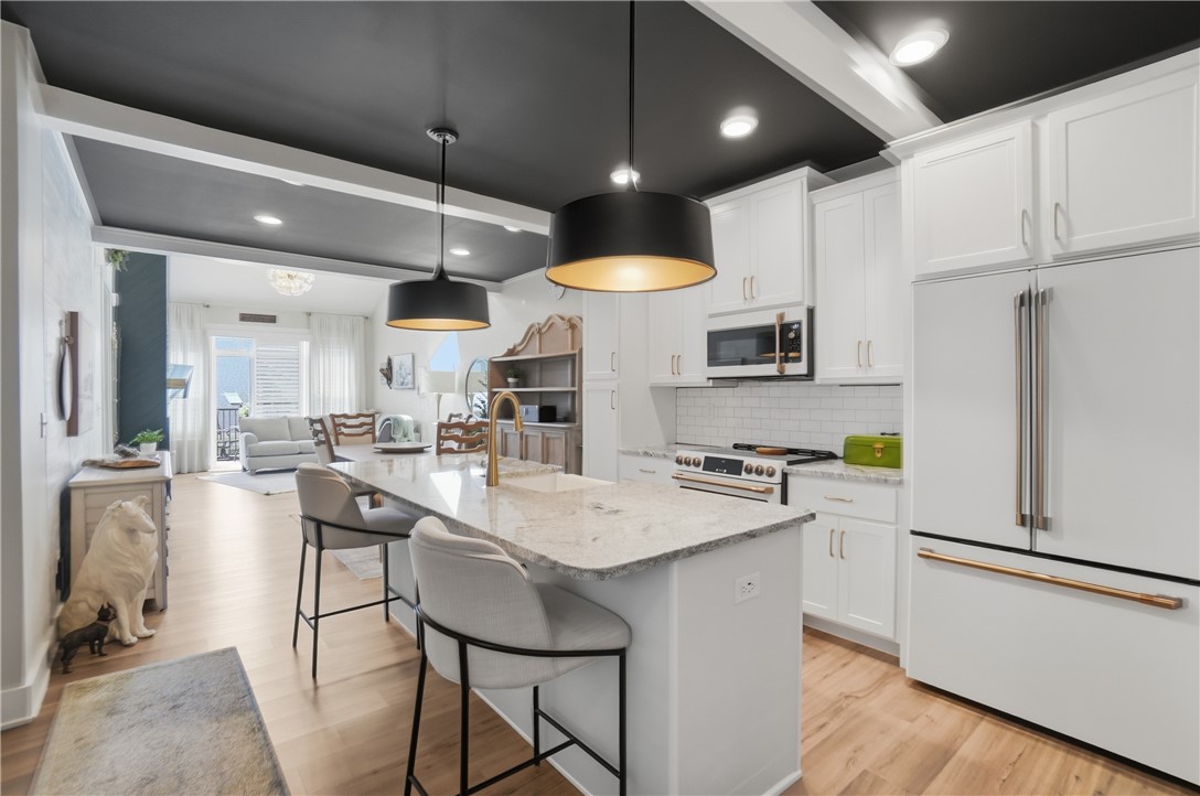 605 Cape Cod Court Beavercreek, OH 45430 - Photo 52 of 54 This bright kitchen and living area features high ceilings and an open floor plan.