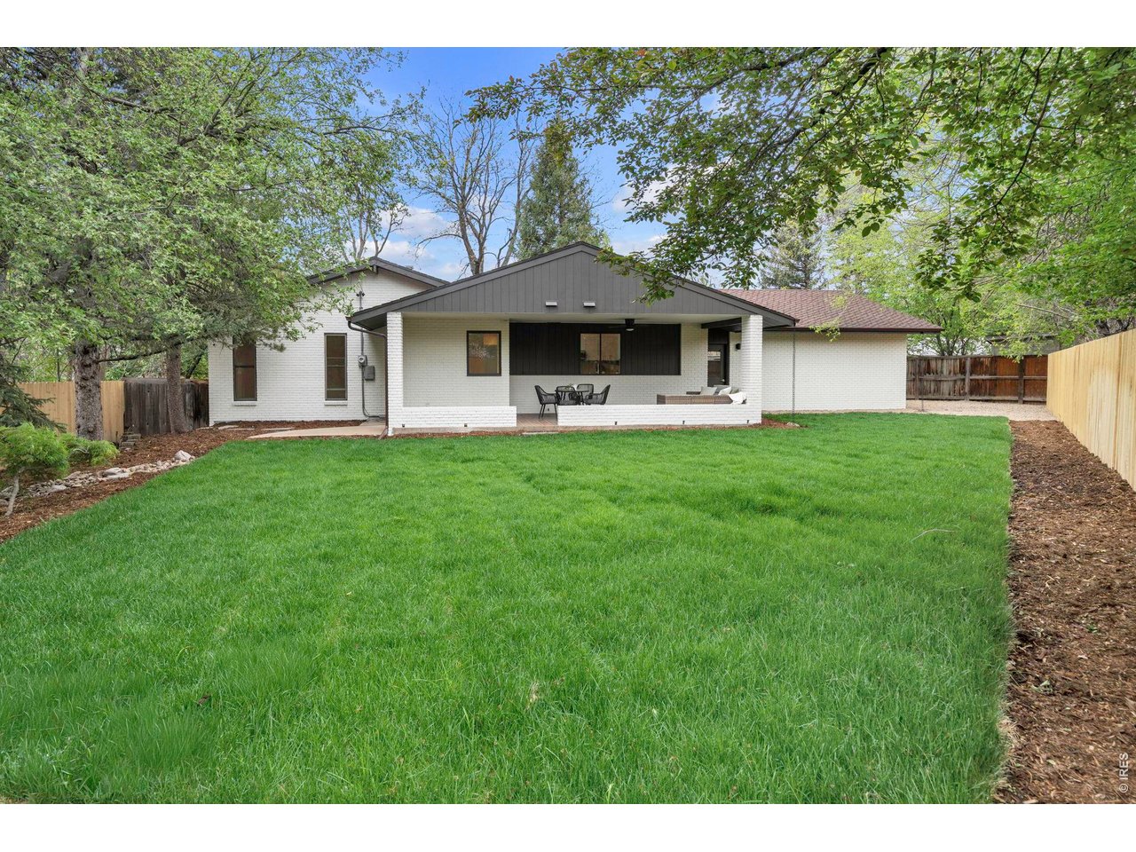 3545 Clover Circle Boulder, CO 80304 - Photo 15 of 36 a front view of a house with a garden