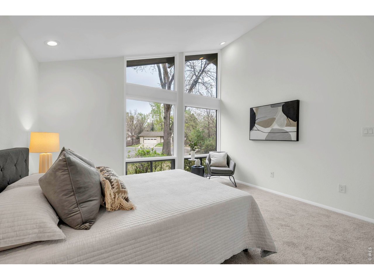 3545 Clover Circle Boulder, CO 80304 - Photo 20 of 36 a bedroom with a bed and a large window