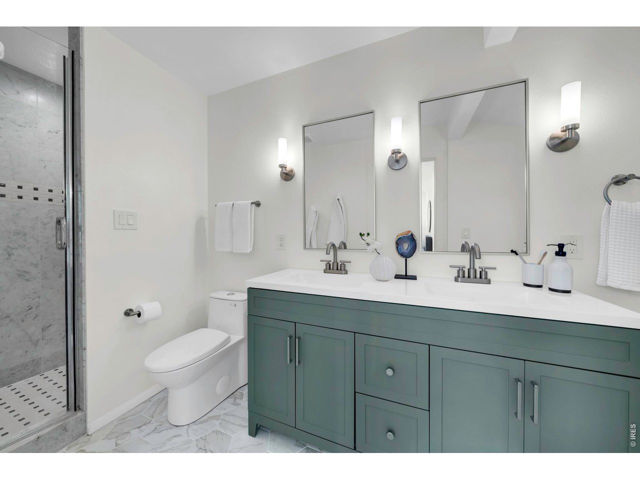 3545 Clover Circle Boulder, CO 80304 - Photo 21 of 36 a bathroom with a double vanity sink toilet and shower