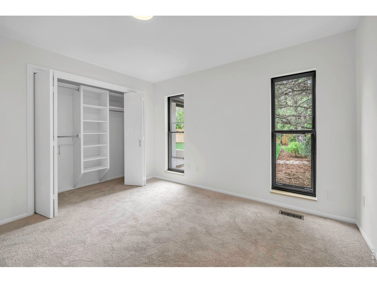 3545 Clover Circle Boulder, CO 80304 - Photo 22 of 36 an empty room with windows and closet