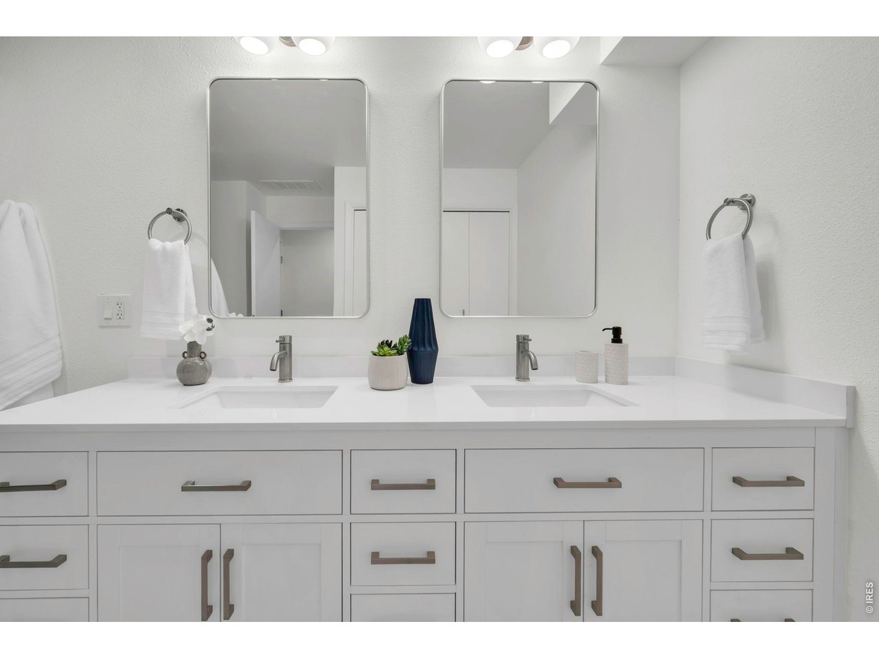 3545 Clover Circle Boulder, CO 80304 - Photo 24 of 36 a bathroom with a double vanity sink mirror and