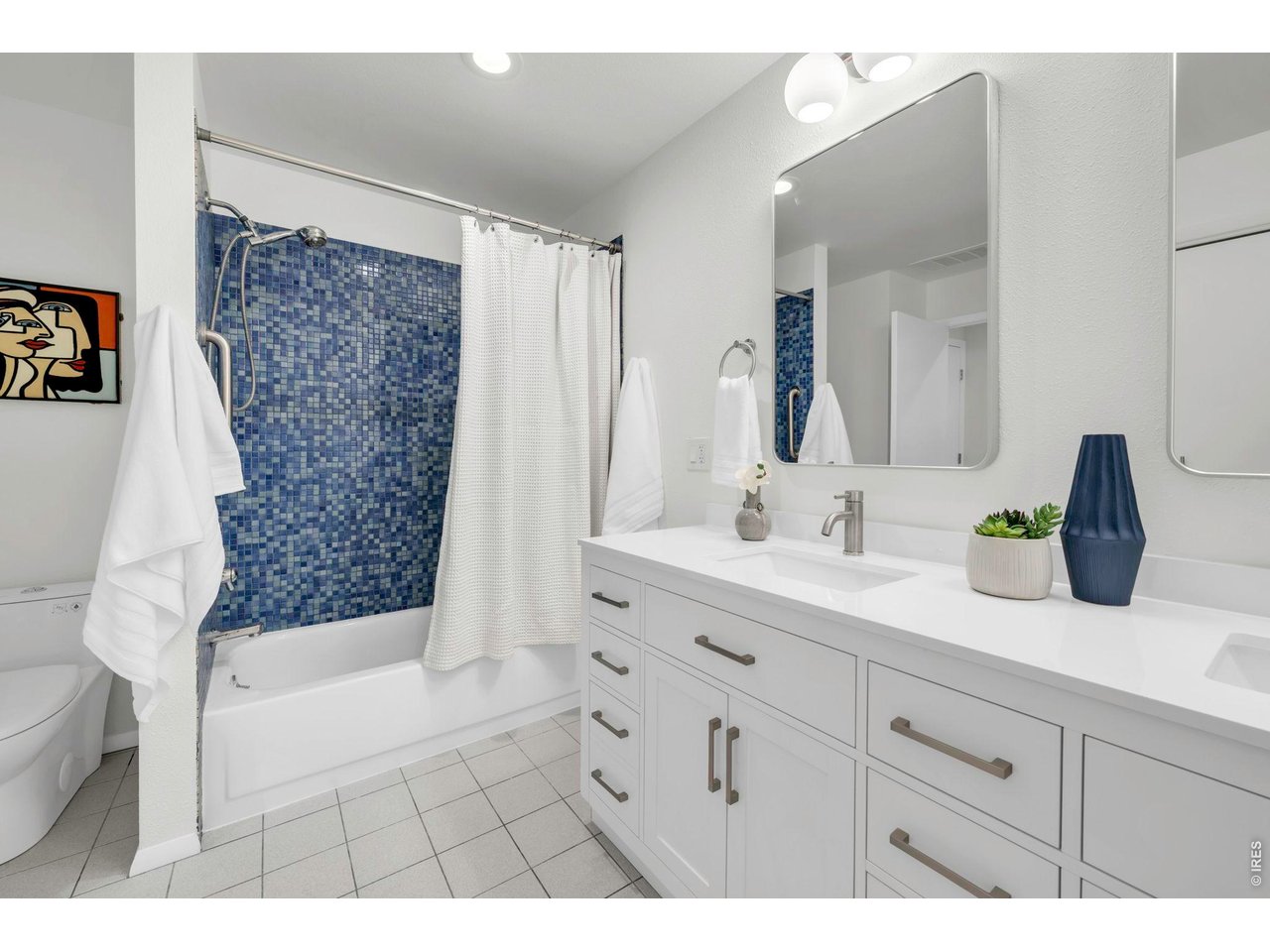 3545 Clover Circle Boulder, CO 80304 - Photo 25 of 36 a bathroom with a bathtub sink and mirror