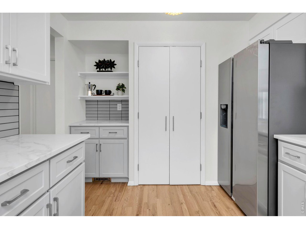 3545 Clover Circle Boulder, CO 80304 - Photo 5 of 36 a kitchen with white cabinets and refrigerator