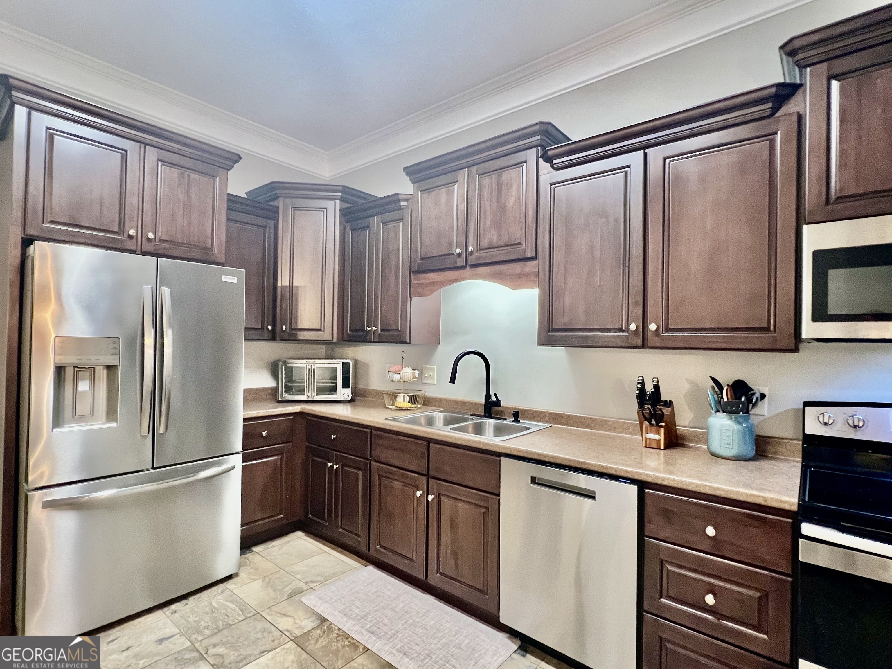 122 Millers Lane Calhoun, GA 30701 - Photo 15 of 60 a kitchen with stainless steel appliances granite countertop a refrigerator sink and cabinets