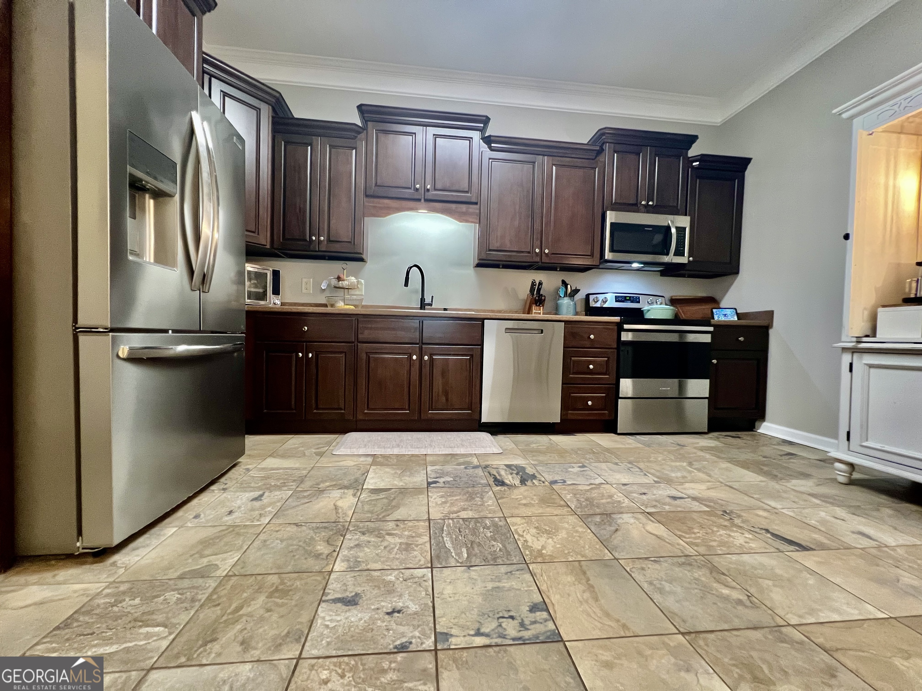 122 Millers Lane Calhoun, GA 30701 - Photo 16 of 60 a kitchen with stainless steel appliances granite countertop a refrigerator sink and stove