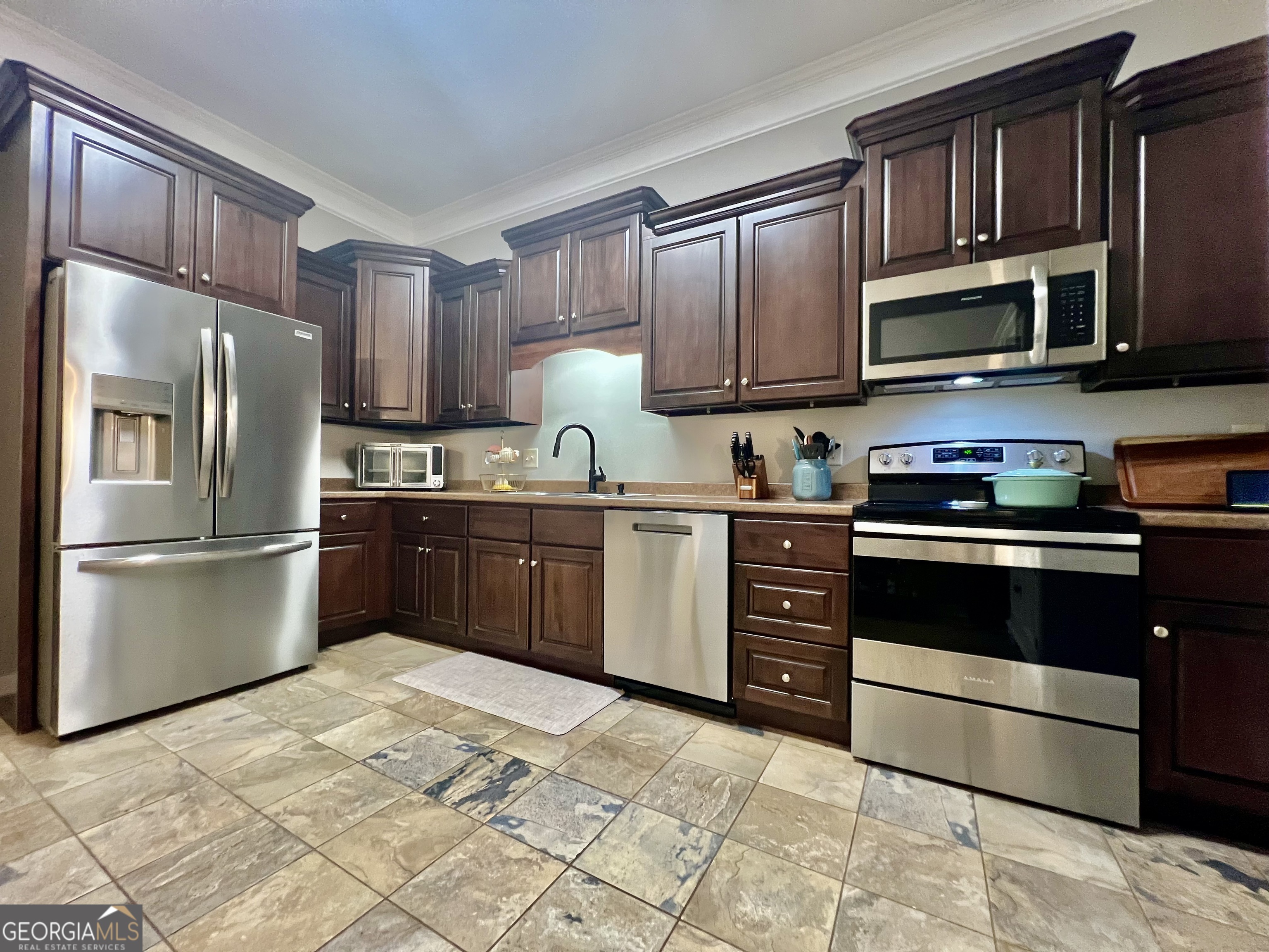 122 Millers Lane Calhoun, GA 30701 - Photo 18 of 60 a kitchen with stainless steel appliances granite countertop a refrigerator stove a sink dishwasher and microwave